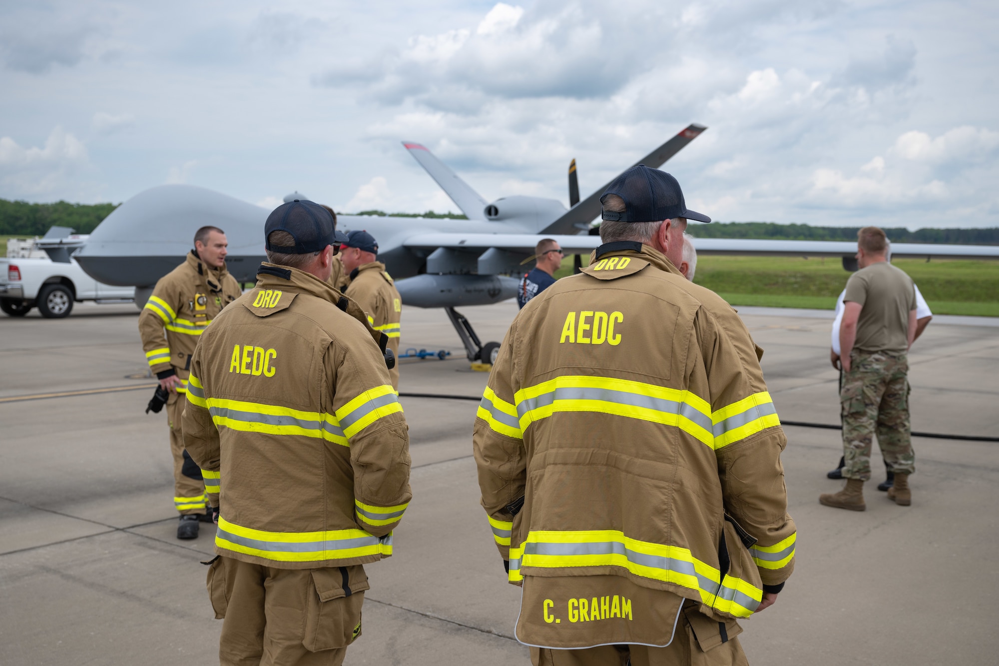 Aircraft Rescue and Fire Fighting crews from Arnold Air Force Base Fire and Emergency Services are familiarized with the MQ-9 Reaper during the portion of the Vigilant Guard exercise conducted at Arnold AFB, Tenn., May 14, 2025. Vigilant Guard is an annual disaster response exercise carried out by National Guard units across the country. Arnold AFB was involved in the portion of Vigilant Guard 2025 focused on airfield management and fuel transfer missions. Guardsmen from the Tennessee National Guard and the North Dakota National Guard were on hand at Arnold to perform the exercise. Arnold AFB Fire and Emergency Services crews supported the effort by maintaining a presence during the arrival and departure of aircraft and throughout the refueling. (U.S. Air Force photo by Keith Thornburgh)