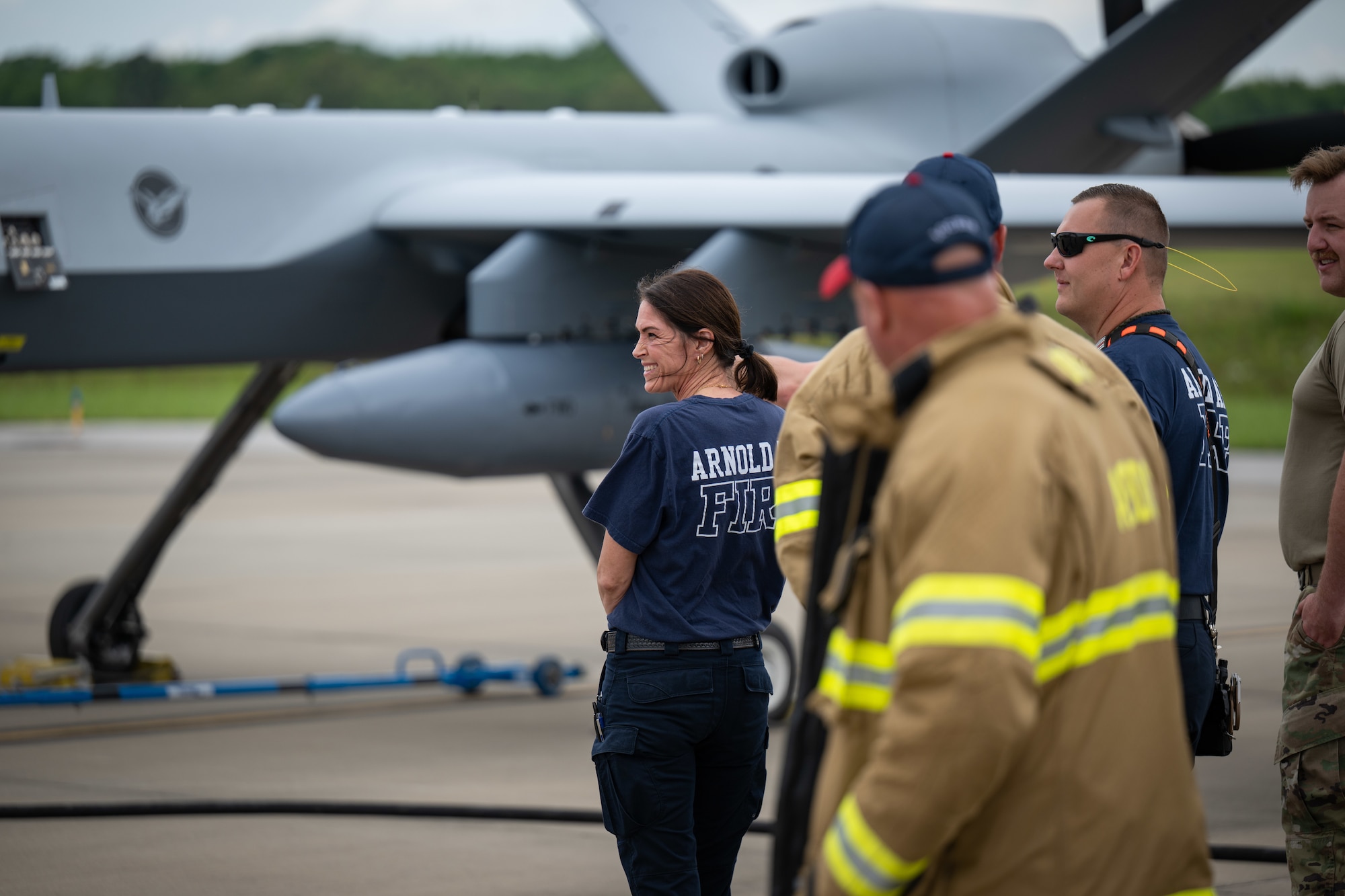 Aircraft Rescue and Fire Fighting crews from Arnold Air Force Base Fire and Emergency Services are familiarized with the MQ-9 Reaper during the portion of the Vigilant Guard exercise conducted at Arnold AFB, Tenn., May 14, 2025. Vigilant Guard is an annual disaster response exercise carried out by National Guard units across the country. Arnold AFB was involved in the portion of Vigilant Guard 2025 focused on airfield management and fuel transfer missions. Guardsmen from the Tennessee National Guard and the North Dakota National Guard were on hand at Arnold to perform the exercise. Arnold AFB Fire and Emergency Services crews supported the effort by maintaining a presence during the arrival and departure of aircraft and throughout the refueling. (U.S. Air Force photo by Keith Thornburgh)