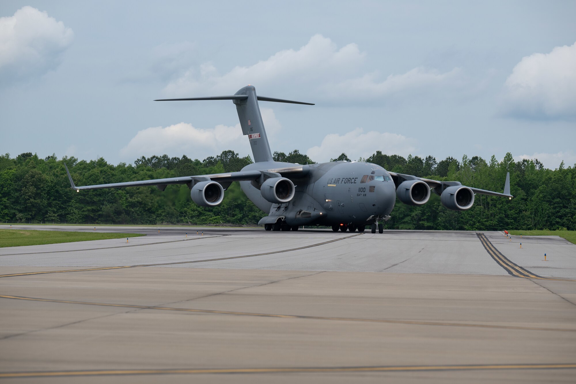 A C-17 Globemaster III from the Tennessee Air National Guard 164th Airlift Wing lands on the airfield at Arnold Air Force Base, Tenn., May 14, 2025. The aircraft was used in support of Vigilant Guard, an annual disaster response exercise. Arnold AFB was involved in the portion of Vigilant Guard 2025 focused on airfield management and fuel transfer missions. Guardsmen from the Tennessee National Guard and the North Dakota National Guard were on hand at Arnold to perform the exercise. Arnold AFB Fire and Emergency Services crews supported the effort by maintaining a presence during the arrival and departure of aircraft and throughout the refueling. Arnold crews also received hands on familiarization with the MQ-9 from Guardsmen present. (U.S. Air Force photo by Keith Thornburgh)