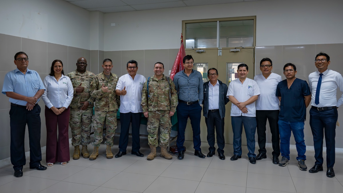 U.S. Air Force AMISTAD team members and Hospital Regional de Loreto leadership pose for a photo on the opening day of AMISTAD 2025 in Iquitos, Peru, June 2, 2025. This Peruvian and U.S. medical assistance training opportunity offers real-world benefits to U.S. and partner nation medical teams and the people of Peru by relieving strained medical systems, training U.S. and local medical professionals, and promoting the health and well-being of the people of Peru. (U.S. Air Force photo by Senior Airman Victoria Edwards)