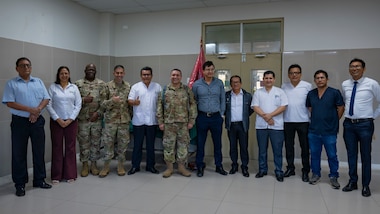 U.S. Air Force AMISTAD team members and Hospital Regional de Loreto leadership pose for a photo on the opening day of AMISTAD 2025 in Iquitos, Peru, June 2, 2025. This Peruvian and U.S. medical assistance training opportunity offers real-world benefits to U.S. and partner nation medical teams and the people of Peru by relieving strained medical systems, training U.S. and local medical professionals, and promoting the health and well-being of the people of Peru. (U.S. Air Force photo by Senior Airman Victoria Edwards)