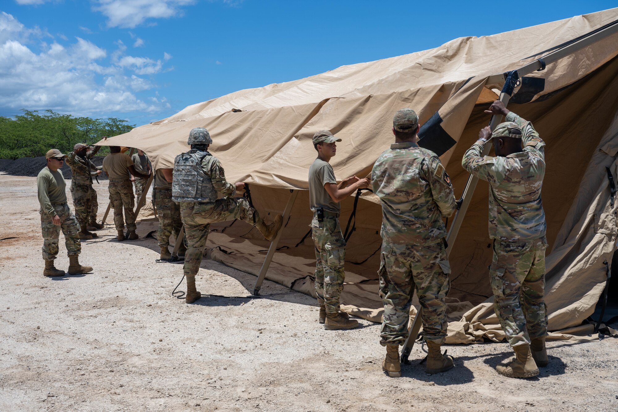 U.S. Air Force civil engineer Airmen put together a make shift shelter.