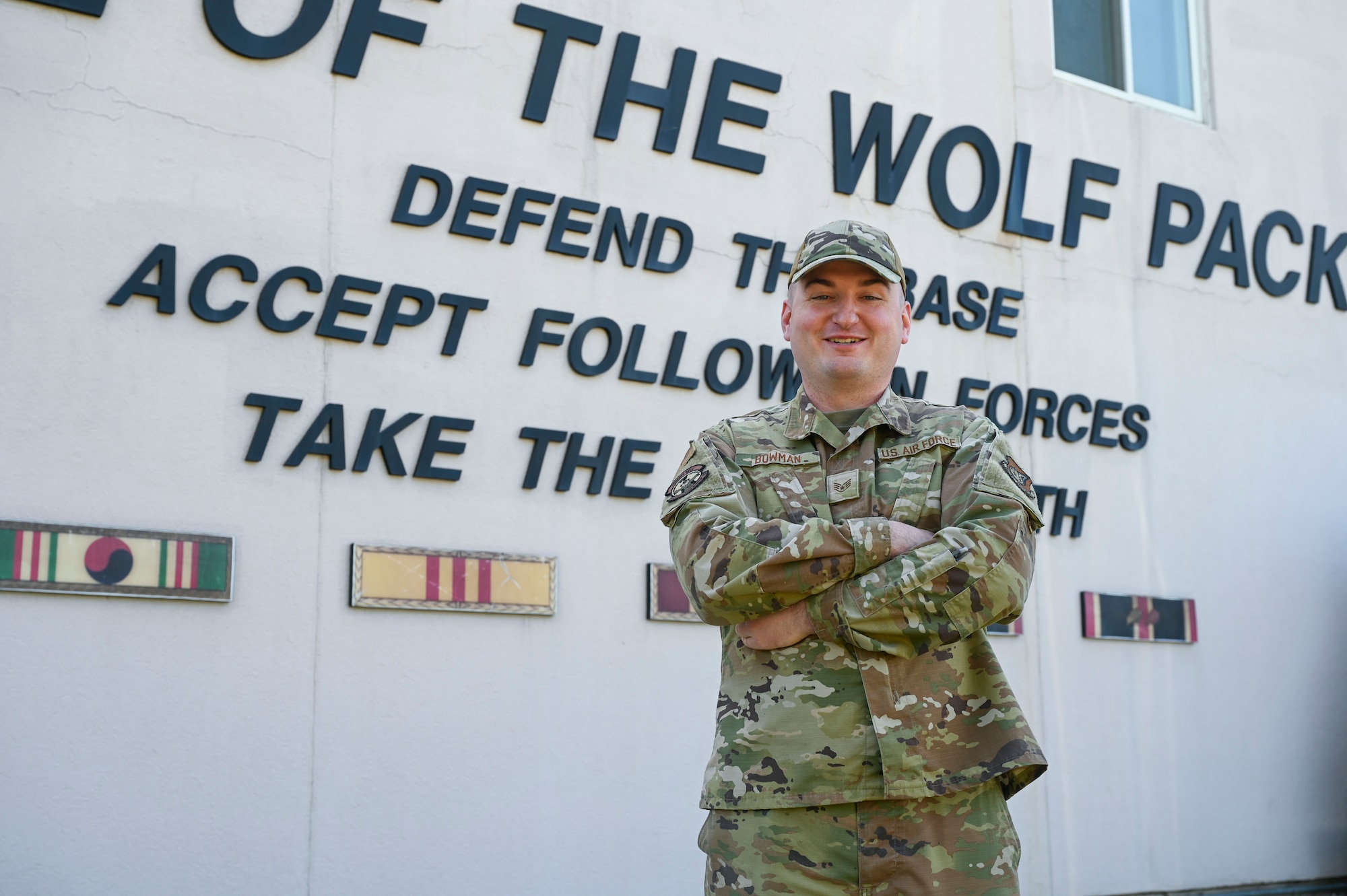 Staff Sgt. Shemuel Bowman, 8th Operations Group group training manager, poses for a photo outside the 8th Fighter Wing headquarters at Kunsan Air Base, Republic of Korea, June 5, 2025. Bowman’s dedication has played a pivotal role in streamlining and enhancing operational effectiveness and ensuring mission continuity for the Wolfpack.