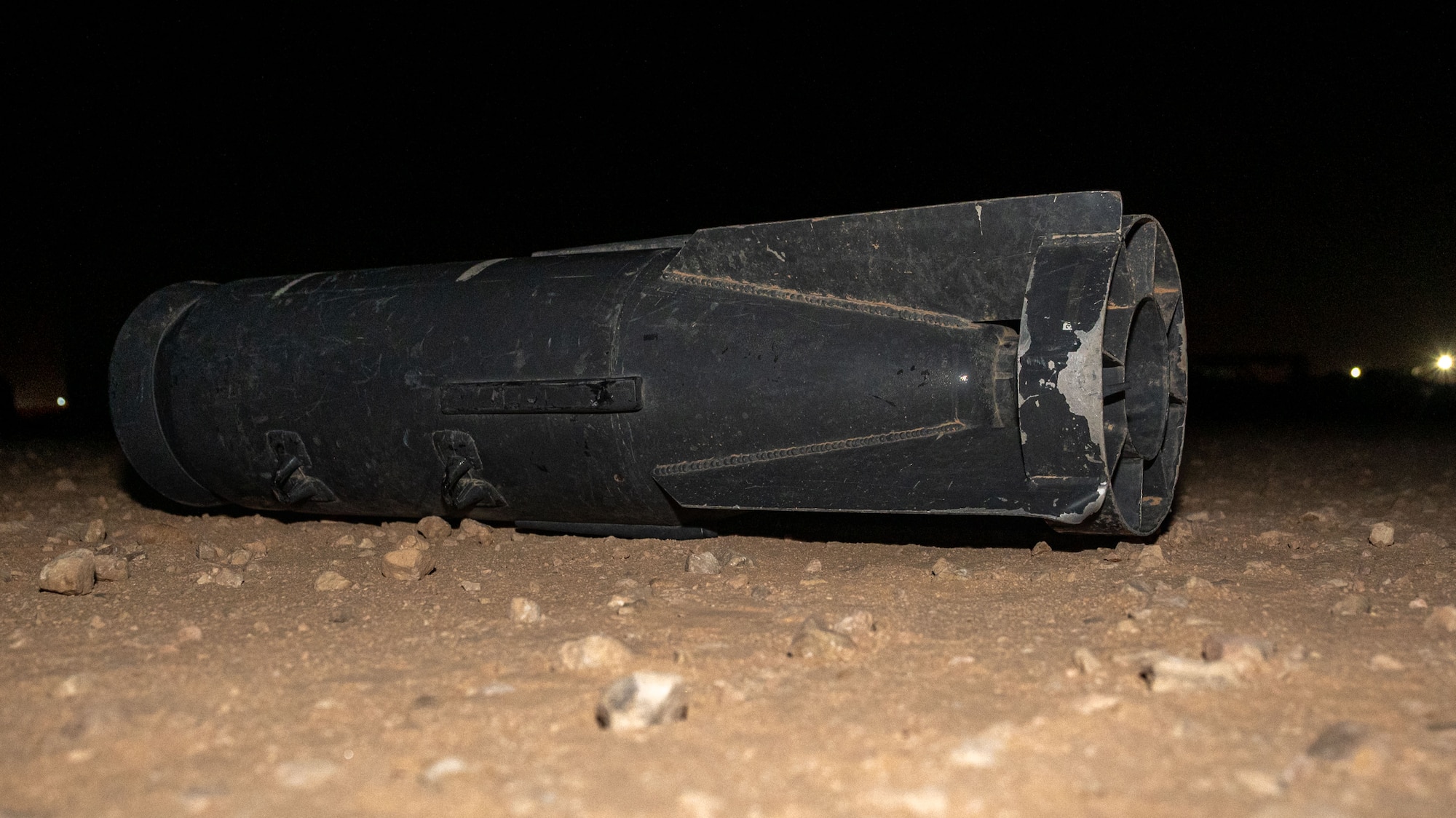 A training ordnance sits on the ground.