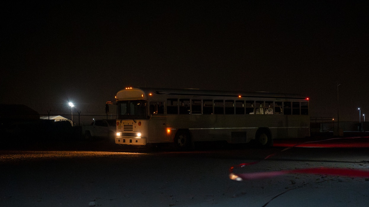 A bus drives around a cordoned area.