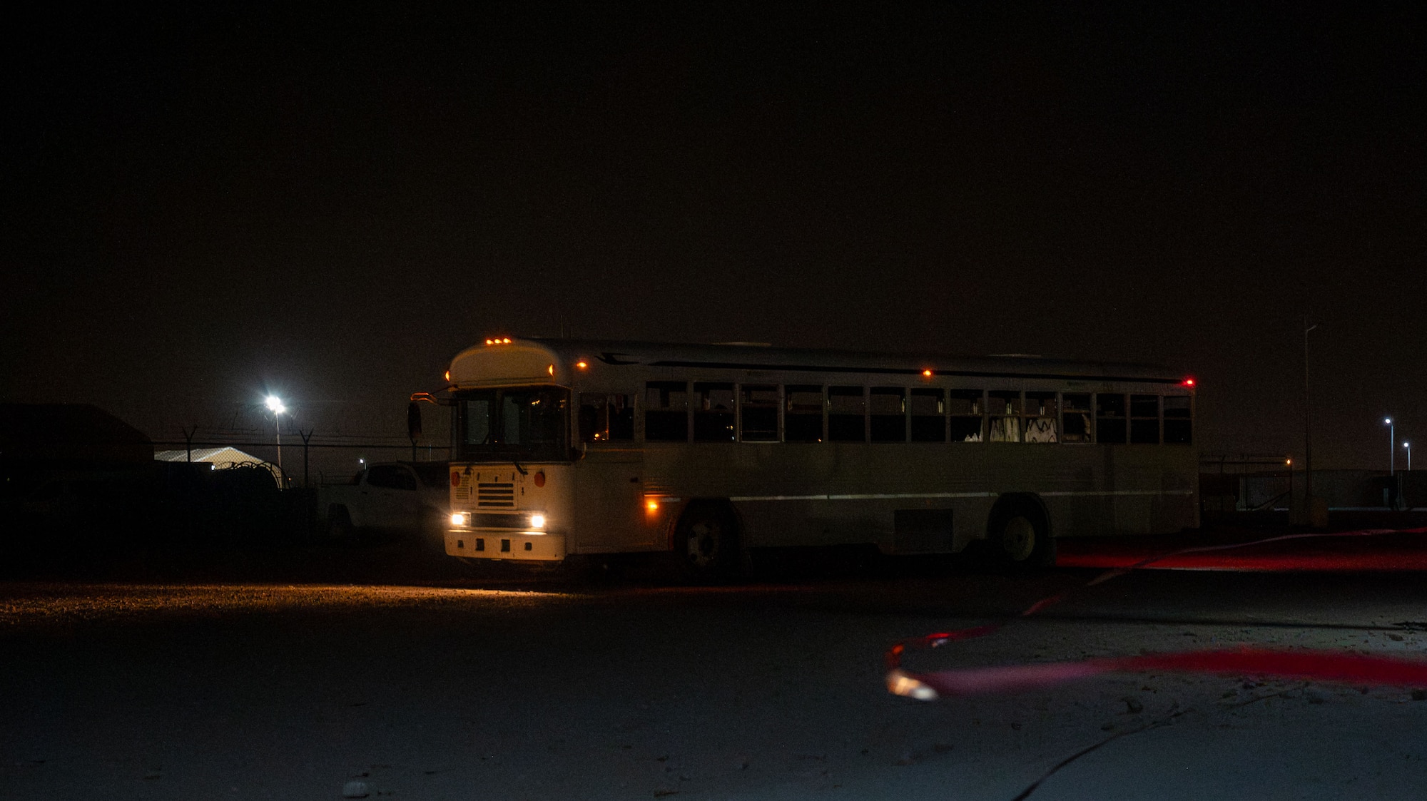 A bus drives around a cordoned area.