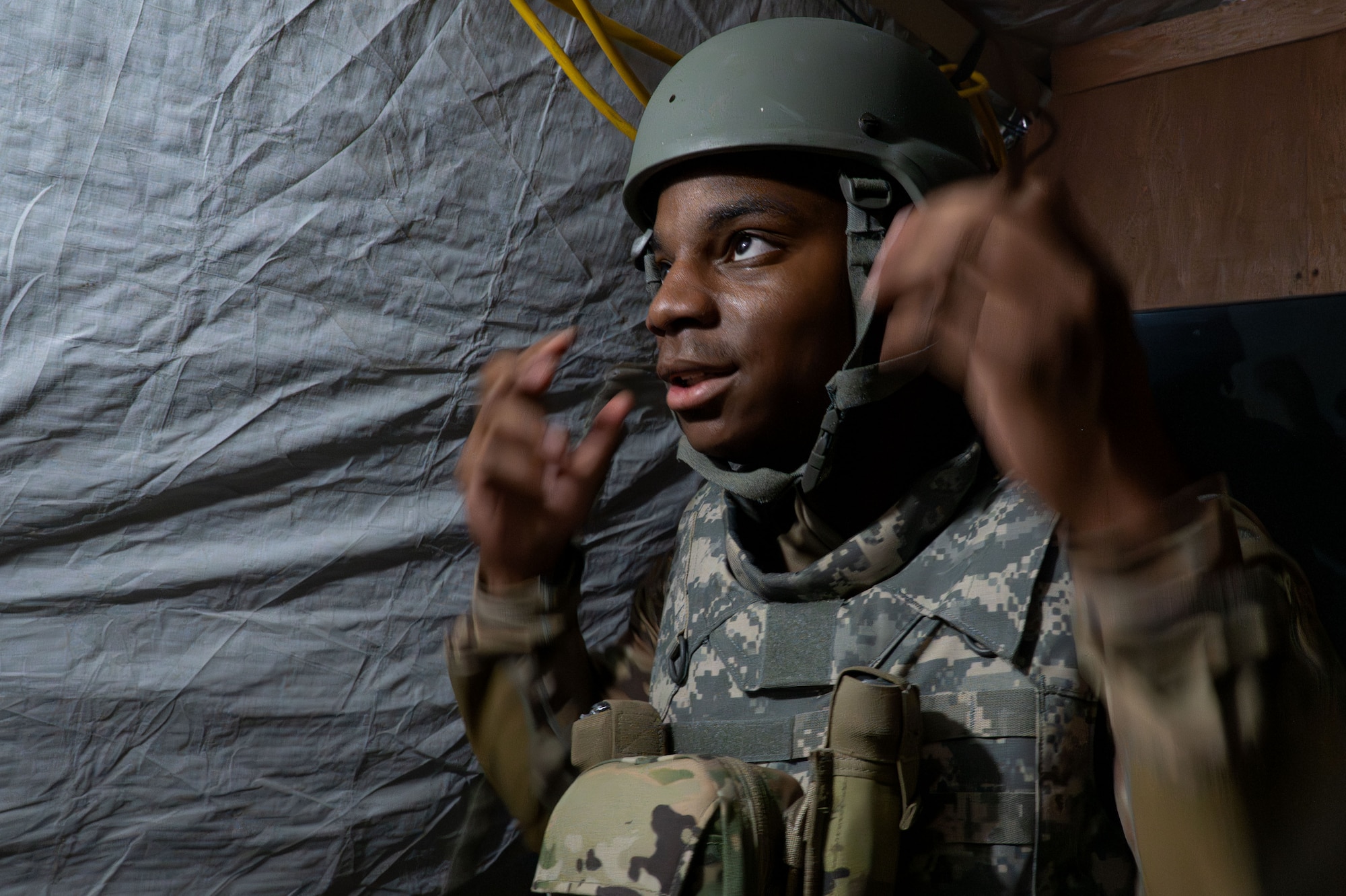 A man puts on his helmet.