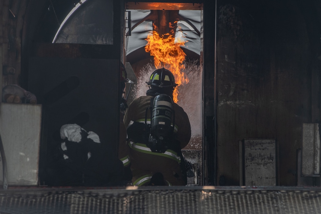 101st Air Refueling Wing Firefighter Extinguishes Fire During Training Exercise