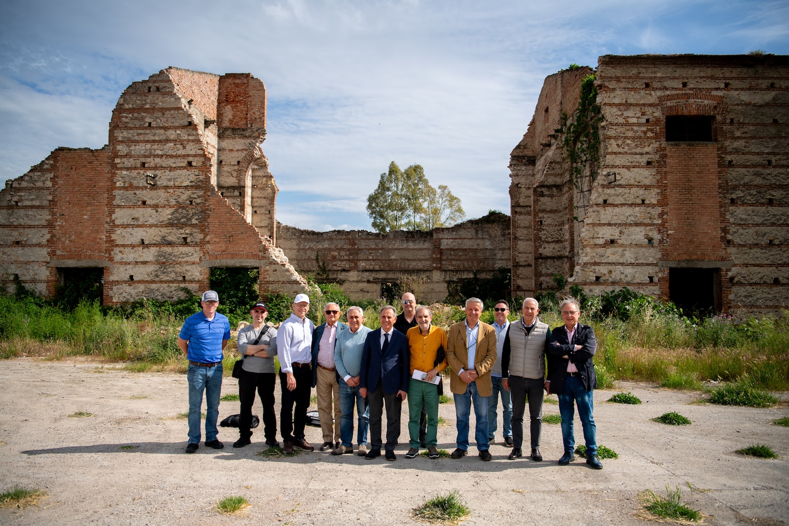 Oklahoma National Guard members pose with Italian civic and business leaders at the Tobacco Factory near Persano, Italy during a Thunderbird Trail project site visit on May 5. The Tobacco Factory, the site of a major battle during World War II between the 45th Infantry Division and German forces occupying Italy following Italy’s surrender to allied forces, is one of the many sites Oklahoma National Guard leadership is evaluating for possible monuments and memorials commemorating the 45th Infantry Division’s World War II service. (Oklahoma National Guard photo by Staff Sgt. Anthony Jones)