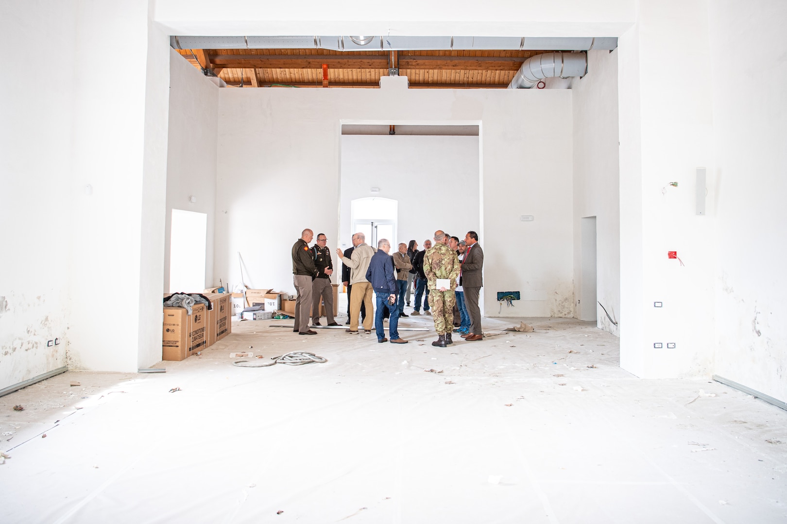 Telese, Italy civic leaders and representatives of the Oklahoma National Guard discuss renovations to a city building in Telese on May 8, that will house a World War II exhibit featuring photos and information from the Oklahoma National Guard Museum in Oklahoma City. While conducting research for the Thunderbird Trail project, Dr. David D’Andrea, historical consultant for the project, discovered a trove of photos in the OKNG Museum’s archives that Telese city officials had never seen. When D’Andrea approached Telese civic leaders they asked to feature the images in a gallery in their city. (Oklahoma National Guard photo by Staff. Sgt. Anthony Jones)