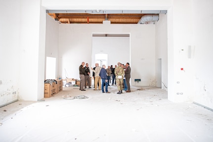 Telese, Italy civic leaders and representatives of the Oklahoma National Guard discuss renovations to a city building in Telese on May 8, that will house a World War II exhibit featuring photos and information from the Oklahoma National Guard Museum in Oklahoma City. While conducting research for the Thunderbird Trail project, Dr. David D’Andrea, historical consultant for the project, discovered a trove of photos in the OKNG Museum’s archives that Telese city officials had never seen. When D’Andrea approached Telese civic leaders they asked to feature the images in a gallery in their city. (Oklahoma National Guard photo by Staff. Sgt. Anthony Jones)
