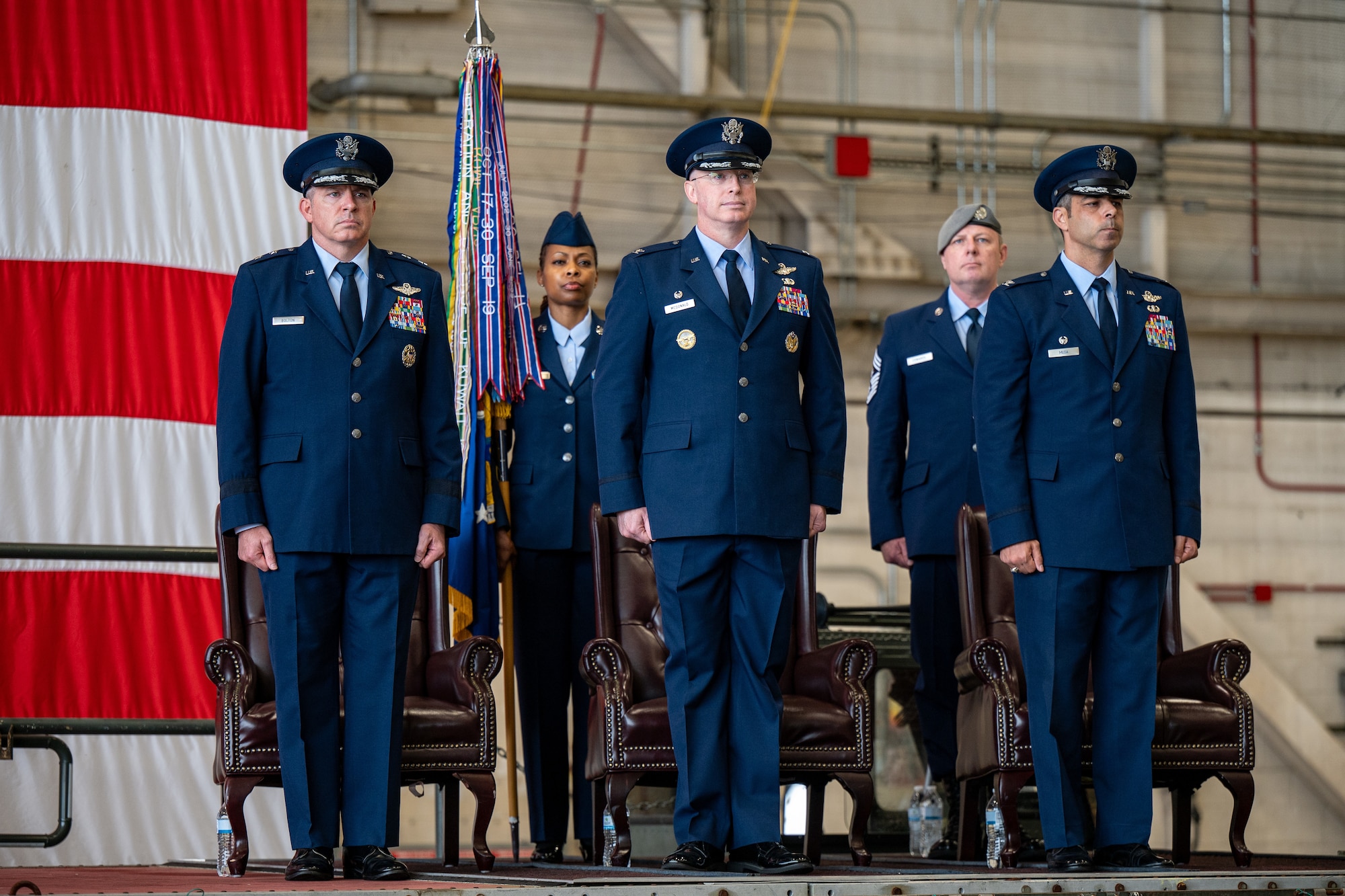 From left, U.S. Air Force Maj. Gen. Charles Bolton, Eighteenth Air Force commander, Col. William ‘Chris’ McDonald, 436th Airlift Wing outgoing commander, and Col. Jamil Musa, 436th AW incoming commander, stand at attention during the 436th AW change of command ceremony on Dover Air Force Base, Delaware, May 30, 2025. McDonald relinquished command in a ceremony attended by friends, family, Team Dover members, local civic leaders and distinguished visitors. (U.S. Air Force photo by Senior Airman Trenten Walters)