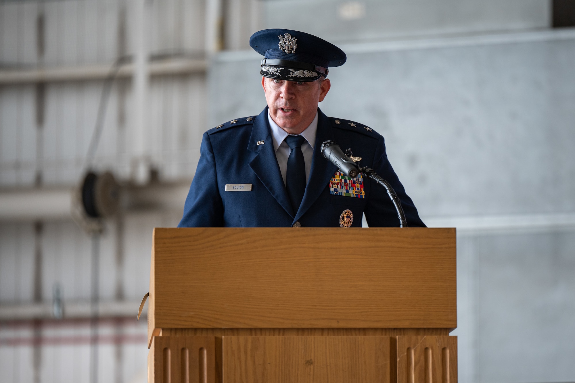 U.S. Air Force Maj. Gen. Charles Bolton, Eighteenth Air Force commander, welcomed Col. Jamil Musa, 436th Airlift Wing incoming commander, and his family to the Eagle Wing, during the 436th AW change of command ceremony on Dover Air Force Base, Delaware, May 30, 2025. Bolton presided over the ceremony in which Col. Jamil Musa assumed command of the Eagle Wing. (U.S. Air Force photo by Senior Airman Trenten Walters)