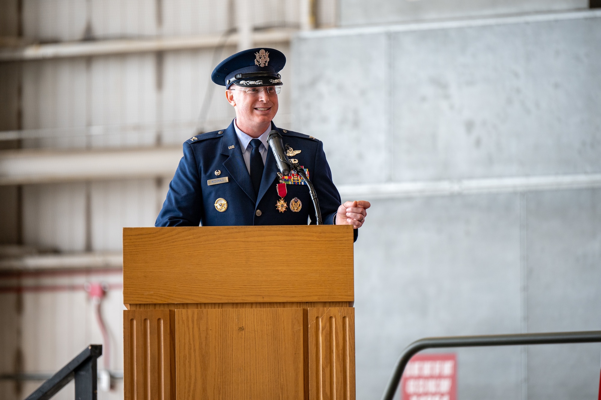 U.S. Air Force Col. William ‘Chris’ McDonald, 436th Airlift Wing outgoing commander, speaks to Team Dover members during the 436th AW change of command ceremony on Dover Air Force Base, Delaware, May 30, 2025. McDonald relinquished command in a ceremony attended by friends, family, Team Dover members, local civic leaders and distinguished visitors.  (U.S. Air Force photo by Senior Airman Trenten Walters)