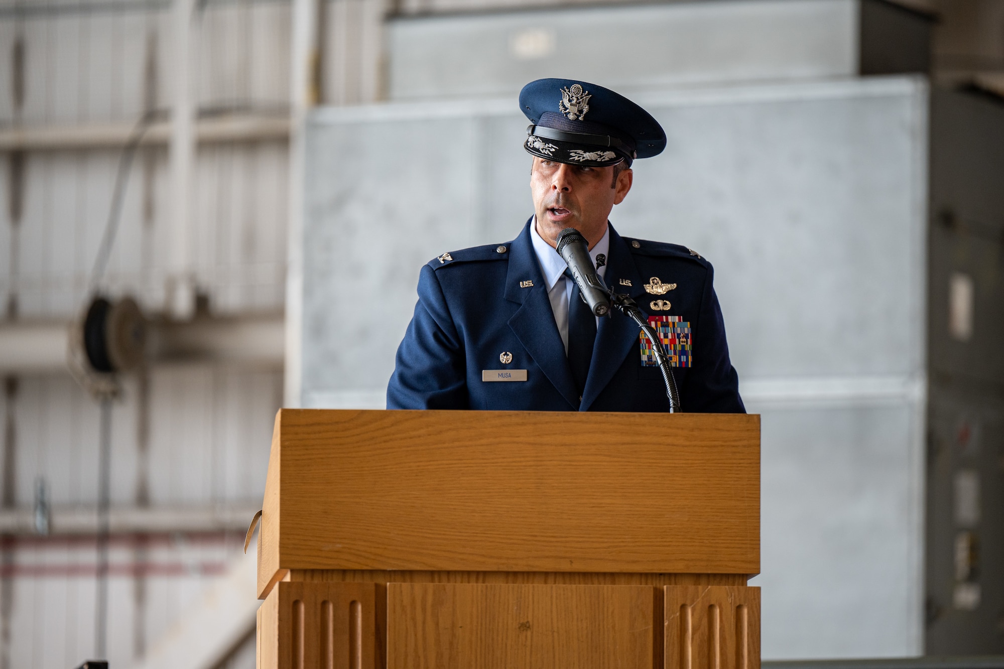 U.S. Air Force Col. Jamil Musa, 436th Airlift Wing commander, speaks to Team Dover members, friends and family, guests, civic leaders and congressional delegates during the 436th AW change of command ceremony on Dover Air Force Base, Delaware, May 30, 2025. Upon taking command, Musa became the wing’s 38th commander. (U.S. Air Force photo by Senior Airman Trenten Walters)