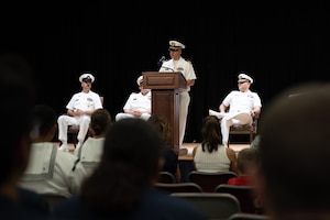U.S. Navy Capt. Luis A. Gonzalez, commodore of Commander, Naval Surface Group Central, presides over a change-of-command ceremony for the Avenger-class mine countermeasures ship USS Sentry (MCM 3) in Manama, Bahrain.