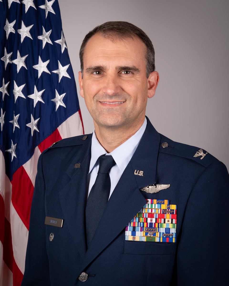 Col. Michael S. Albert, deputy commander of the 434th ARW official photo in front of U.S. flag