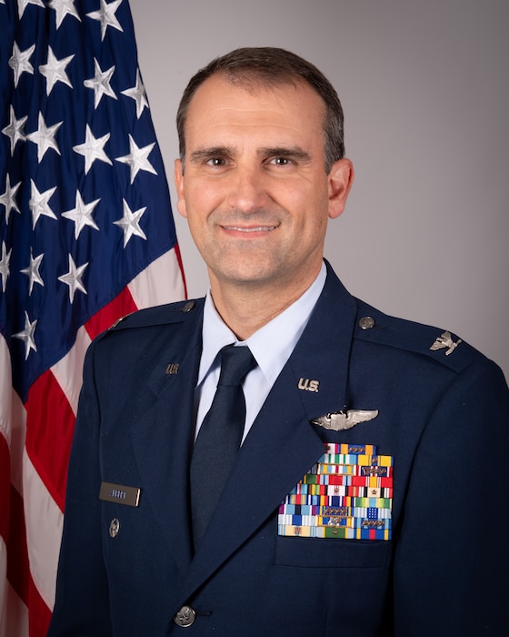 Col. Michael S. Albert, deputy commander of the 434th ARW official photo in front of U.S. flag