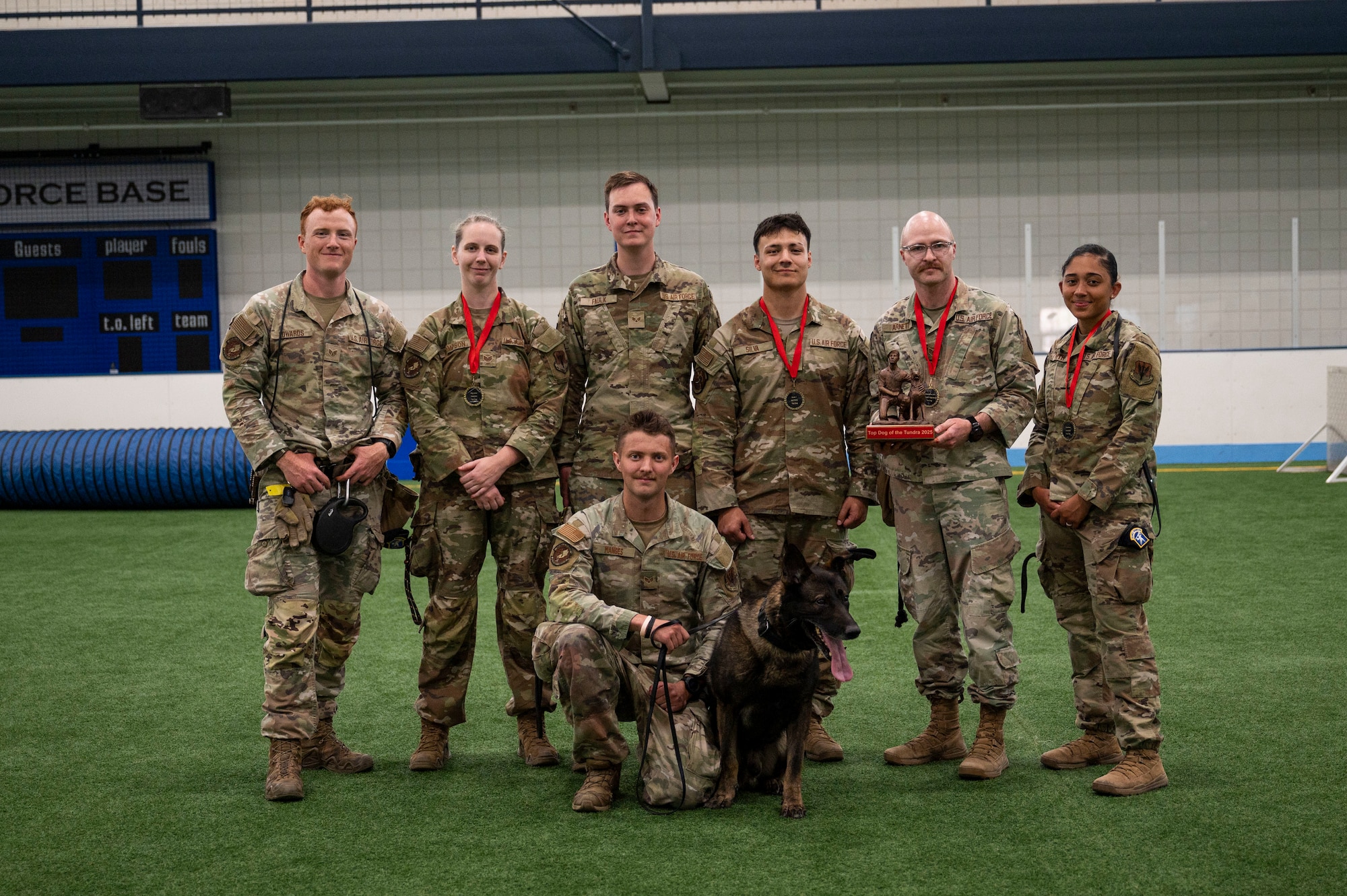 A group of airmen assigned to the 319th Security Forces Squadron and the 5th Security Forces Squadron pose for a photo at Grand Forks Air Force Base, N.D., May 13, 2025.
