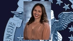 Headshot of woman with brown hair wearing tan v-neck shirt with buttons - placed on horizontal background.
