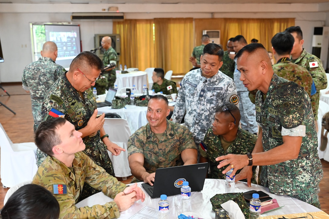 U.S. Marine Corps Master Gunnery Sgt. Paul O’donnell, the operations chief for Marine Rotational Force – Darwin 25.3, I Marine Expeditionary Force Forward, collaborates with service members from the Armed Forces of the Philippines and Australian Defence Force during KAMANDAG 9 at Fort Bonifacio, Manila, Philippines, May 30, 2025. The Senior Enlisted Symposium allowed service members from the Philippines, U.S., Republic of Korea, Japan, and Australia to share their insight and experience as senior enlisted leaders to overcome common challenges. KAMANDAG is an annual Philippine Marine Corps and U.S. Marine Corps-led exercise aimed at enhancing the Armed Forces of the Philippines’ defense and humanitarian capabilities by providing valuable training in combined operations with foreign militaries in the advancement of a Free and Open Indo-Pacific. MRF-D is an annual six-month rotational deployment to enhance interoperability with the Australian Defence Force and allies and partners and provide a forward-postured crisis response force in the Indo-Pacific. (U.S. Marine Corps photo by Capt. John Fischer)