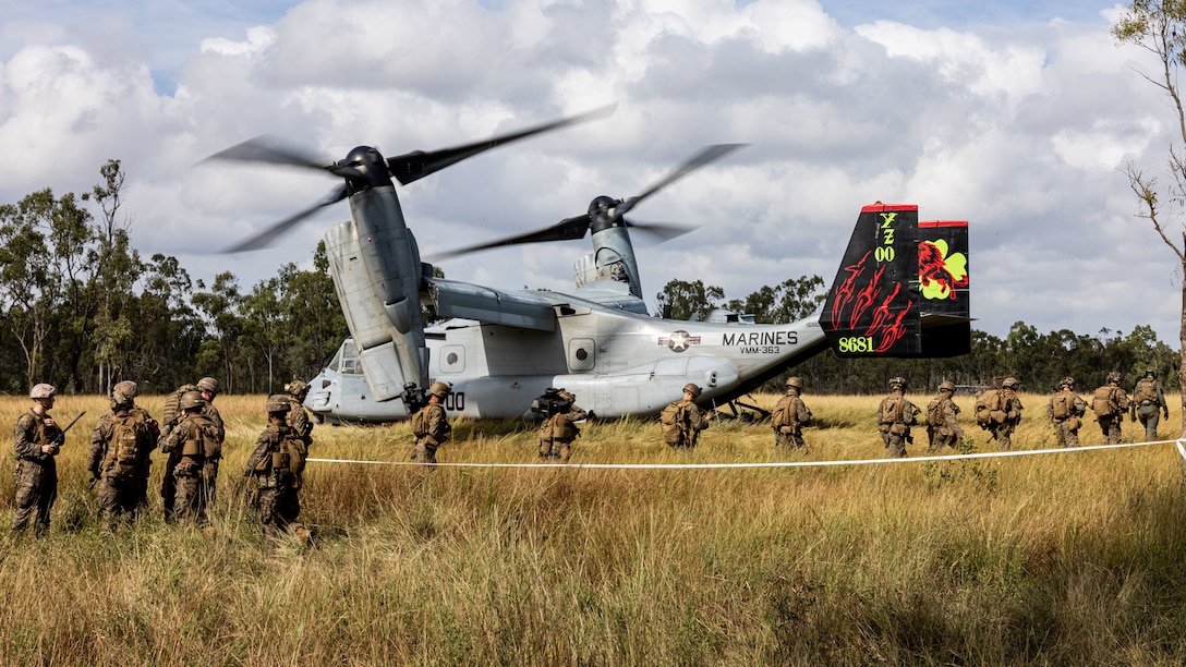 U.S. Marines with 2nd Battalion, 1st Marine Regiment, with Marine Rotational Force – Darwin 25.3, prepare to board an MV-22B Osprey assigned to Marine Medium Tiltrotor Squadron (VMM) 363, MRF-D, during Exercise Southern Jackaroo at Townsville Field Training Area, Queensland, Australia, May 28, 2025. Southern Jackaroo is an annual exercise held between the U.S. Marine Corps, Australian Defence Force, and Japanese Ground Self Defense Force designed to enhance interoperability and combined readiness with Allies and partners. MRF-D is an annual six-month rotational deployment to enhance interoperability with the Australian Defence Force and allies and partners and provide a forward postured crisis response force in the Indo-Pacific. (U.S. Marine Corps photo by Cpl. Angelina Sara)