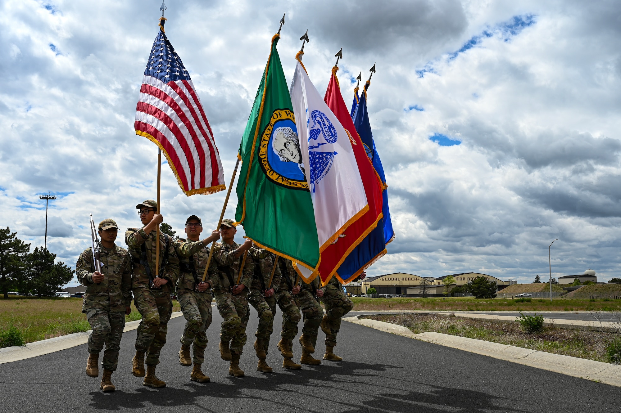Airmen hold flags