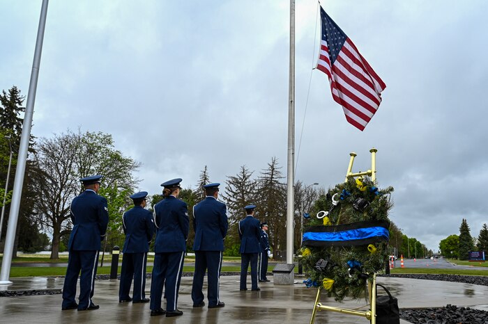 Airmen stand in uniform