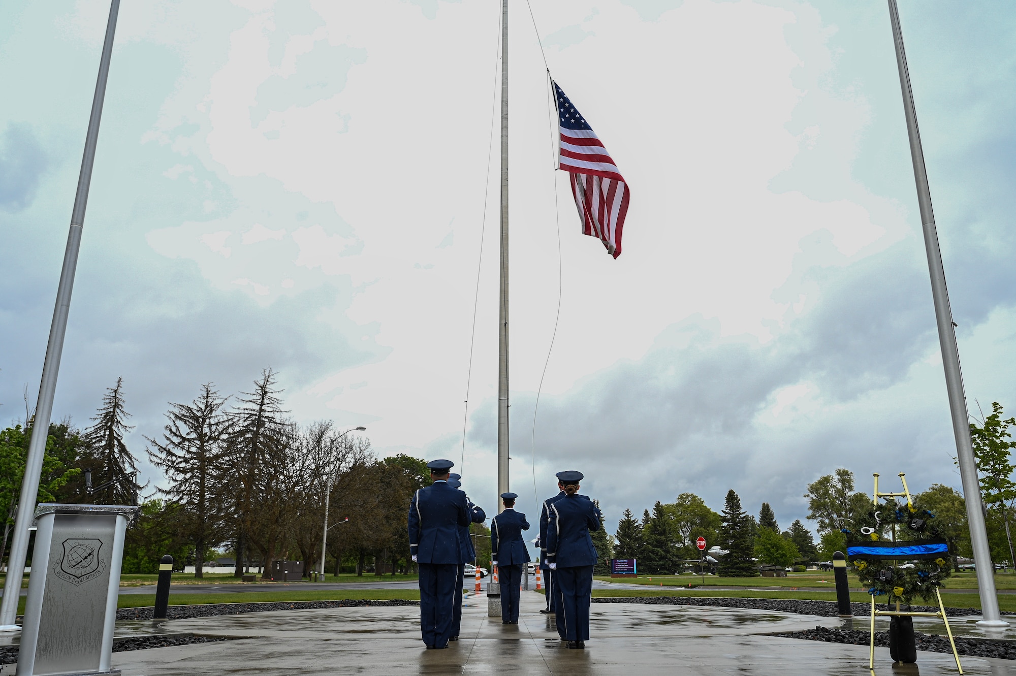 Airmen salute a flag