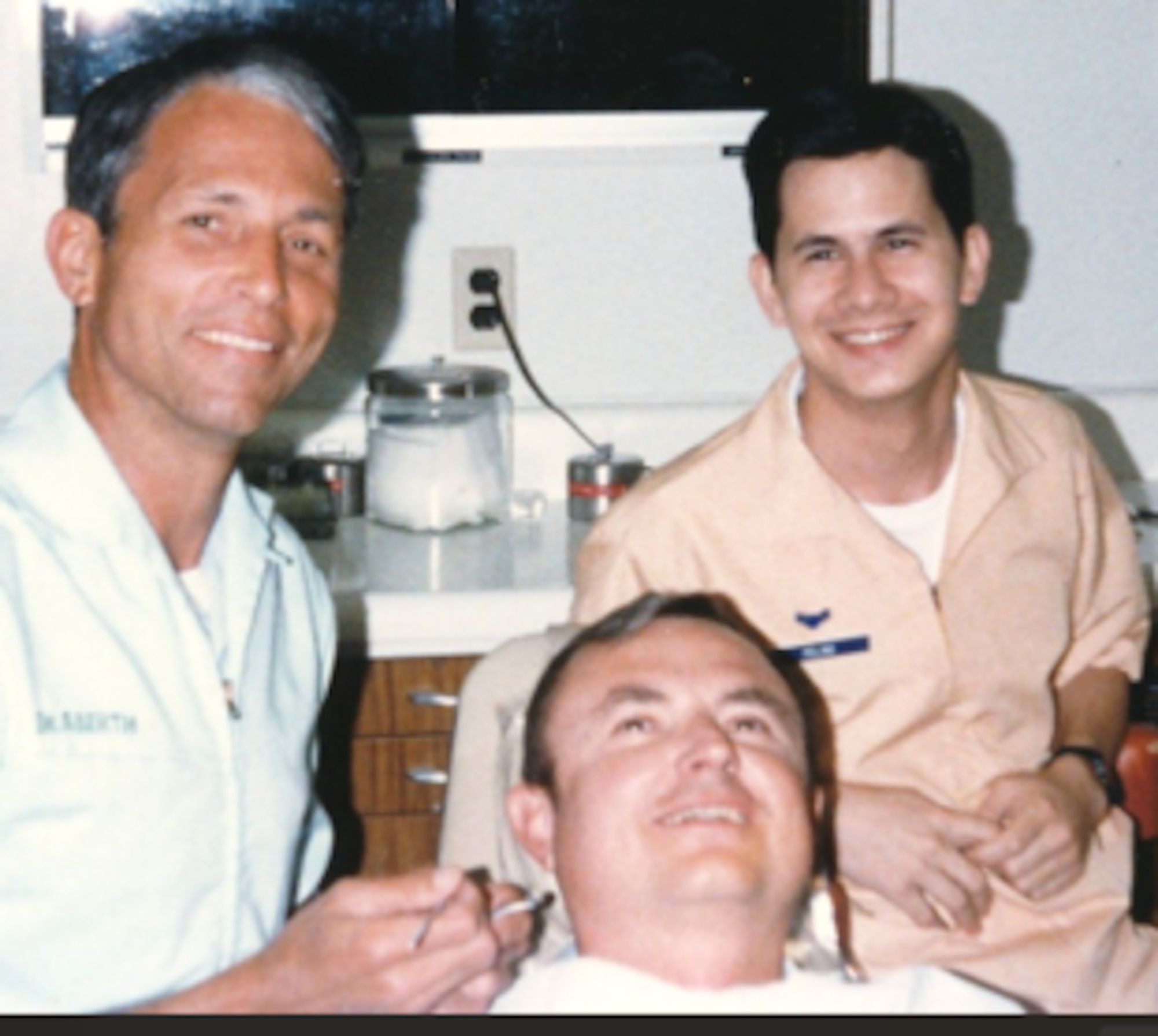 David Pelino, 97th Comptroller Squadron unit program coordinator, smiles with a dentist and patient at Langley Air Force Base, Virginia, in 1988. During Pelino’s service as an active-duty Airman, he was a dental technician and retired as a master sergeant after 26 years. (Courtesy photo)