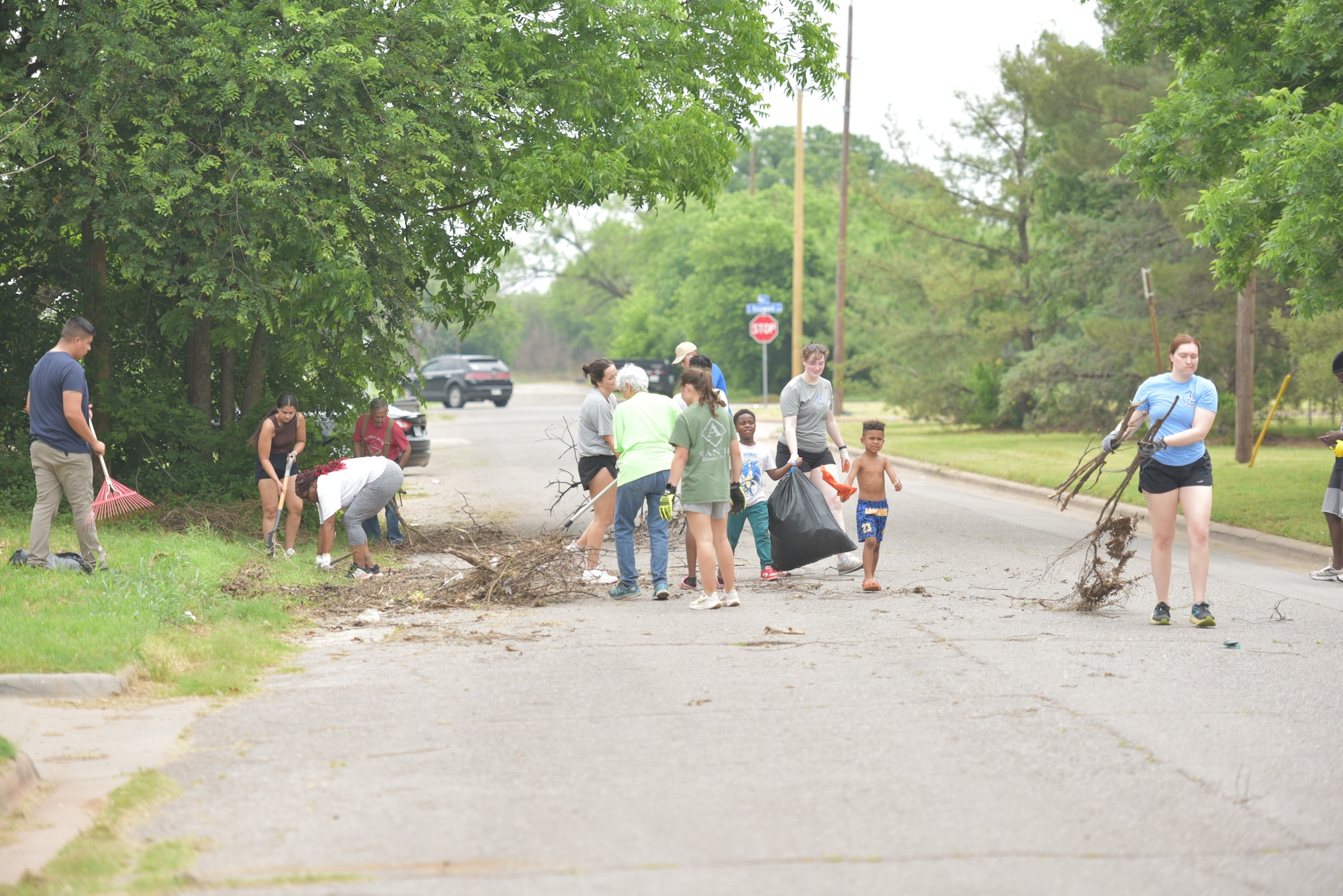 Team members from Sheppard Air Force Base collect debris as part of the Colbert Project local cleanup