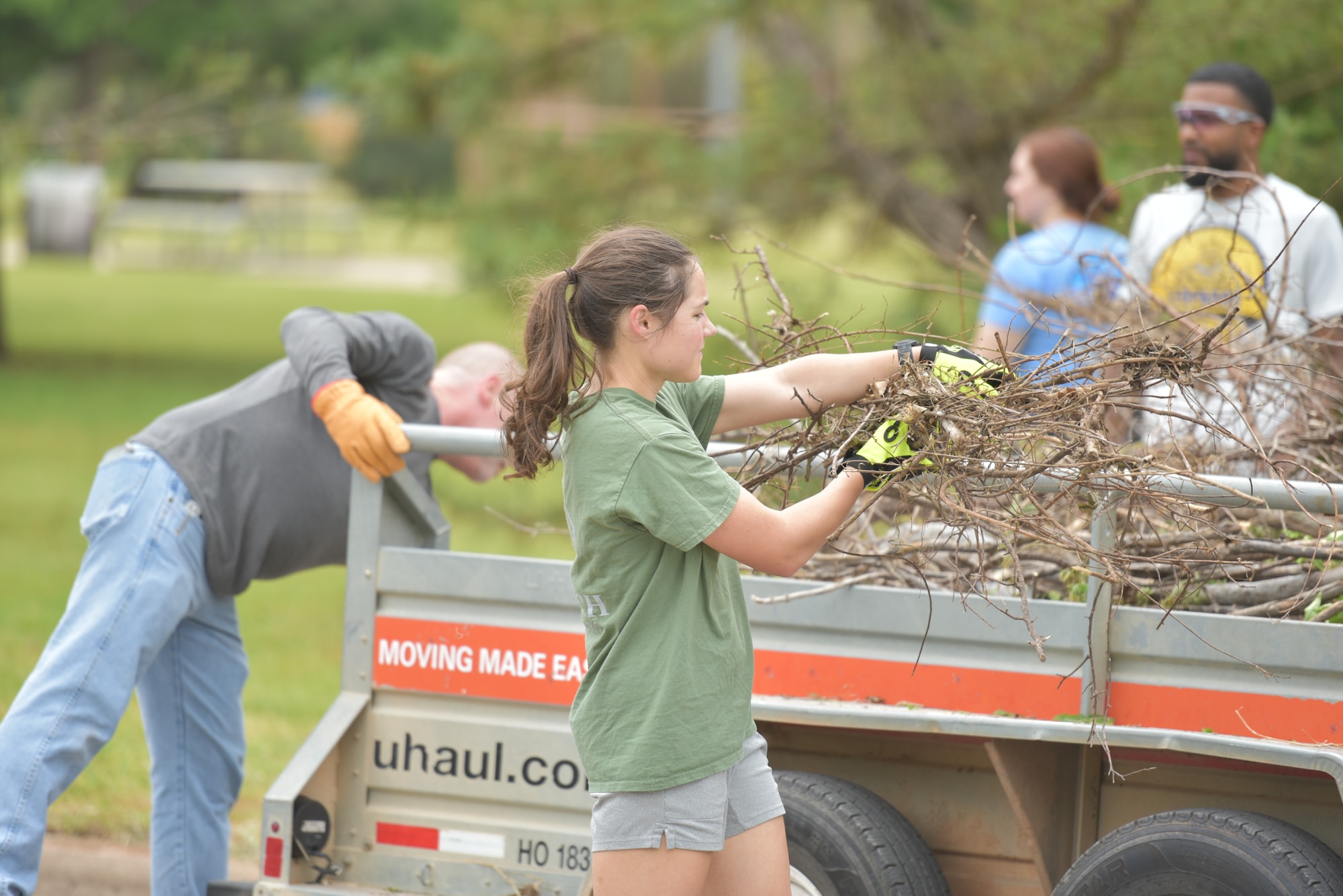 Team members from Sheppard Air Force Base load a truck with debris as part of the Colbert Project local cleaup