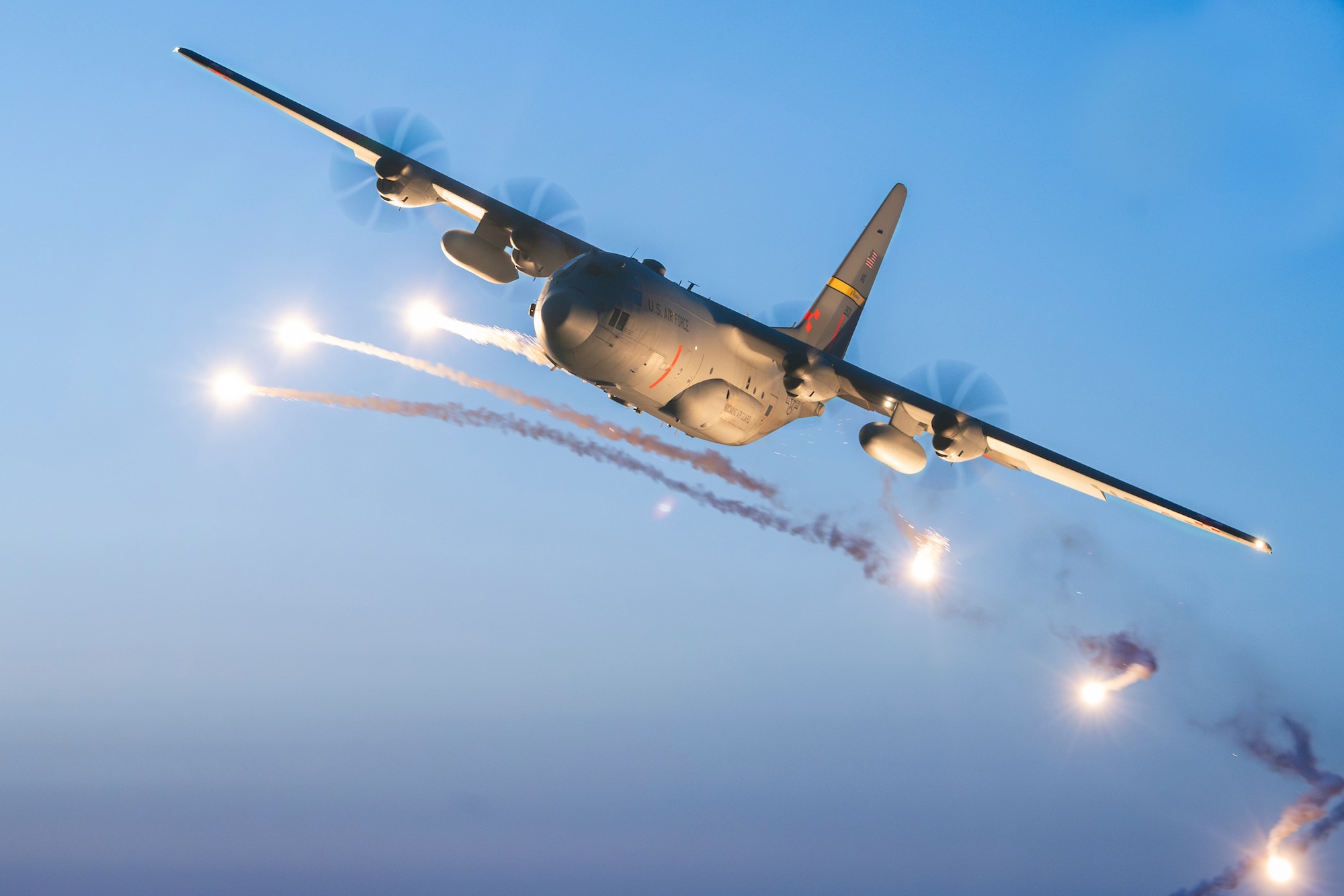 C-130 Hercules aircraft deploys flares as part of a training mission.