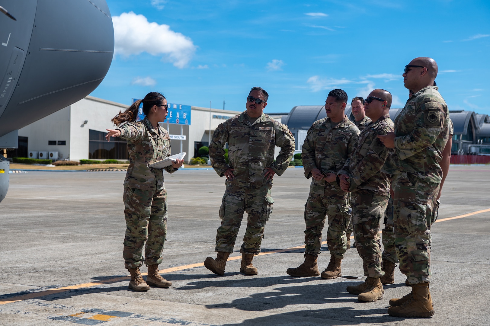 U.S. Air Force Senior Airman Julie Hinh, assigned with the 129th Rescue Wing, California Air National Guard, conducts a walk-around briefing of the HC-130J's features and capabilities during Exercise Balikatan ’25, Cebu City, Philippines, May 1, 2025.