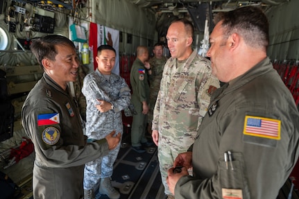 U.S. Air Force airmen assigned with the 129th Rescue Wing, California Air National Guard, and Philippine Air Force airmen conduct a static tour of the HC-130J during Exercise Balikatan '25, Cebu City, Philippines, Apr. 29, 2025.