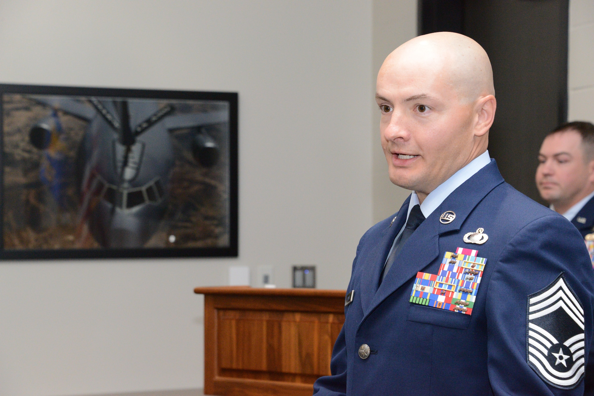 U.S. Air National Guard Chief Master Sgt. Kyle Fisher, 185th Air Refueling Wing’s Finance Senior Enlisted Leader, speaks to an audience