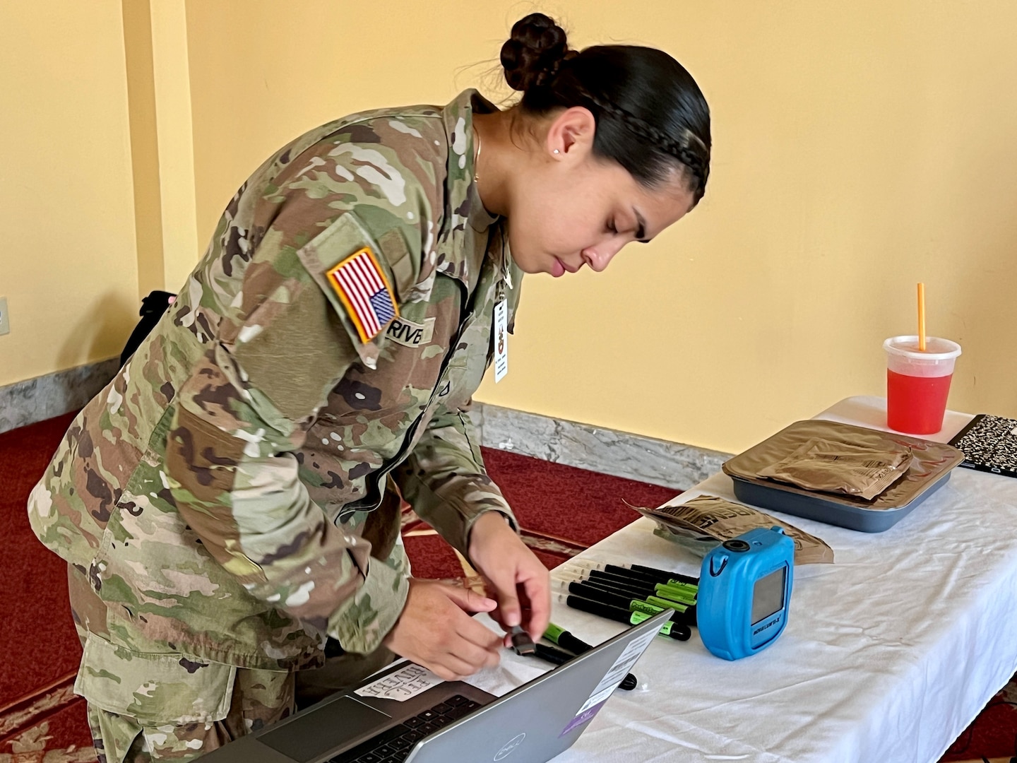 Female Soldier mans an information station.