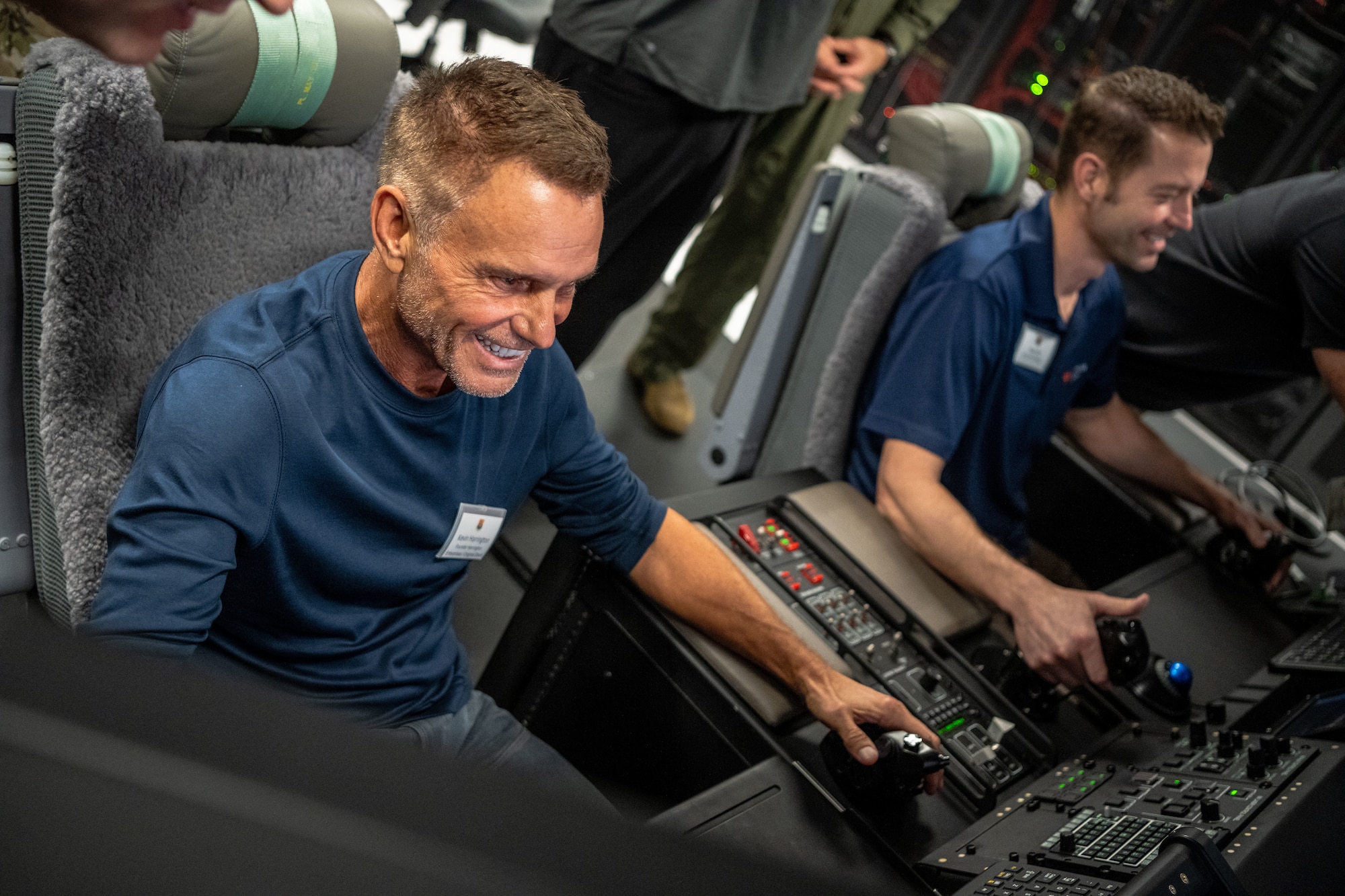 Kevin Herrington, Tampa-based entrepreneur and Shark Tank member, operates an AC-130J Ghostrider gunner simulator during a tour of Hurlburt Field, Florida, May 21, 2025. During their tour, guests met with key leaders from across Air Force Special Operations Command to develop a better understanding of Air Mobility Command’s impact on wider Department of Defense initiatives. (U.S. Air Force photo by Senior Airman Zachary Foster)