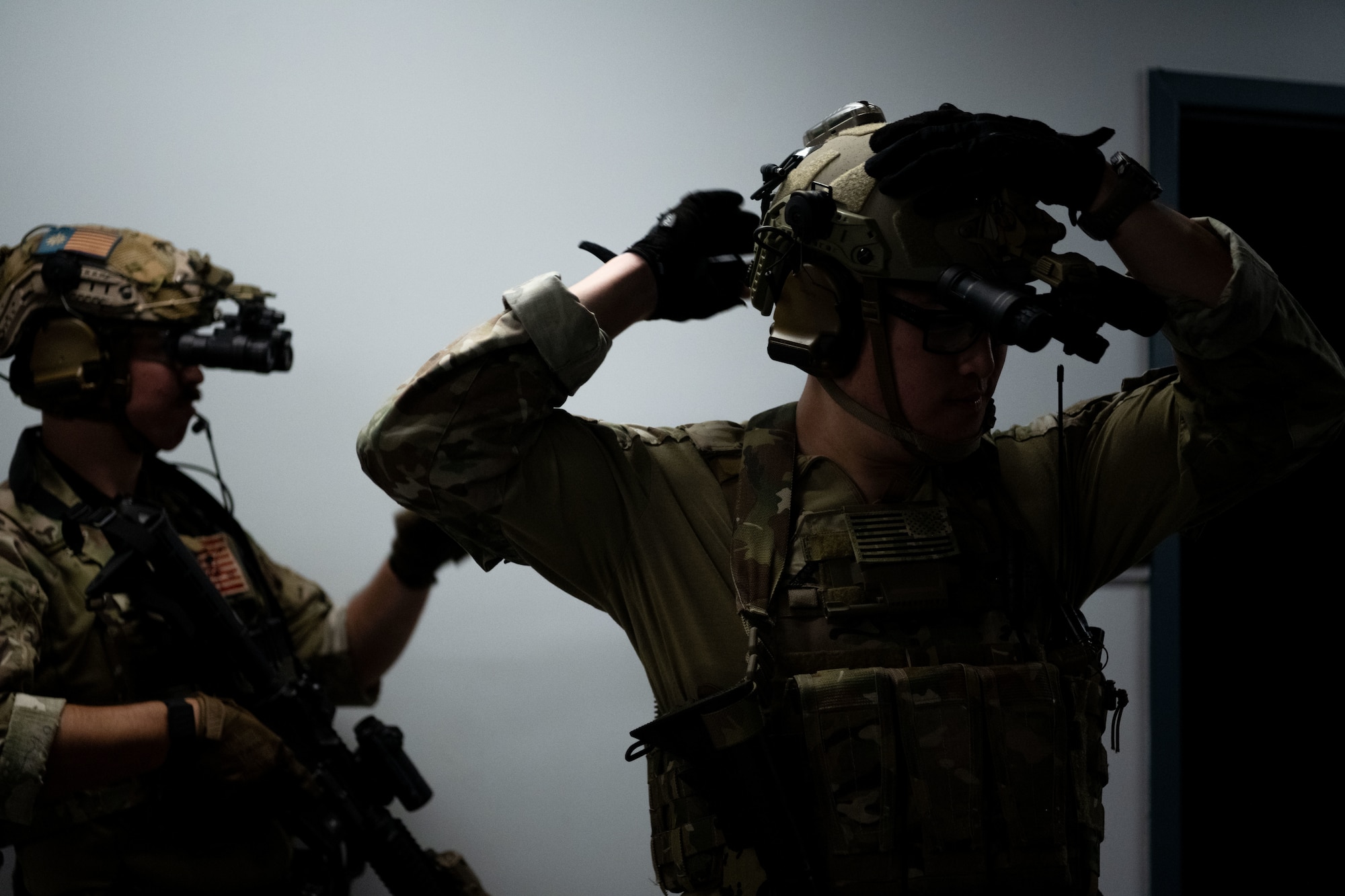 Combat camera (COMCAM) members assigned to the 1st Combat Camera Squadron, showcase room clearing capabilities for civic leaders from the Tampa Bay metropolitan area during a tour of Joint Base Charleston, South Carolina, May 22, 2025. COMCAM personnel showcased their multi-capable mindset with a room clearing and intelligence gathering demonstration. (U.S. Air Force photo by Senior Airman Zachary Foster)