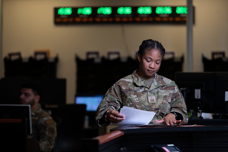 Master Sgt. Sasha Gray, a controller, in the Air Force Mortuary Affairs Operations Command, Control and Communication section, reviews the daily checklists, June 13, 2024.