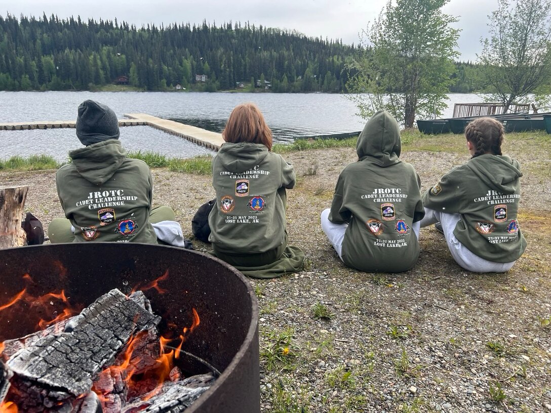 Junior ROTC cadets prepare for canoe-over-canoe recovery drills and a 200-foot open water swim building confidence, endurance, and teamwork in a challenging environment at Chisholm Lake in Fairbanks, Alaska, May 30, 2025. The training was part of the JROTC Cadet Leadership Challenge camp, designed to develop leadership skills, teamwork, and military discipline among cadets.