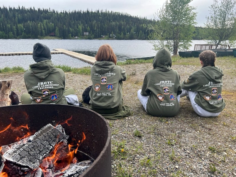 Junior ROTC cadets prepare for canoe-over-canoe recovery drills and a 200-foot open water swim building confidence, endurance, and teamwork in a challenging environment at Chisholm Lake in Fairbanks, Alaska, May 30, 2025. The training was part of the JROTC Cadet Leadership Challenge camp, designed to develop leadership skills, teamwork, and military discipline among cadets.