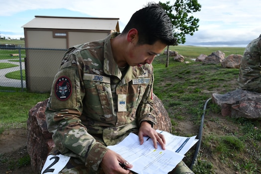  Spc 4 Ed Jons, 68th Cyberspace Squadron, completes cognitive event during the Space Operations Command's inaugural Top Guardian Competition at Schriever Space Force Base, Colo., June 3, 2025.  The course spanned 12 miles and included 16 physical and tactical tasks, testing the elite physical culture and mental fortitude of U.S. Space Force members. (U.S. Space Force photo by Lt. Col. Victoria Hight)