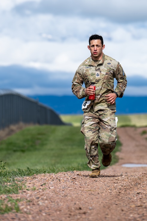  SCHRIEVER SPACE FORCE BASE,  Colo. -- U.S. Space Force Tech Sergeant Juston Campos, NCOIC Unit Operations, runs toward the next station during the SPOC Top Guardian competition at Schriever Space Force Base, Colorado on June 3, 2023. Spoc Top Guardian featured multiple tactical and physical waystations to test Guardian's mental and physical prowess. (U.S. Space Force Photo by Dalton Prejeant)