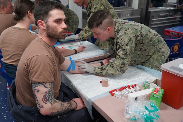 250521-N-FT324-7876. ROTA, SPAIN (May 21, 2025). Hospital Corpsman 3rd Class Brian Jones, from Naval Medical Readiness Training Command (NMRTC), Rota, assists with laboratory draws aboard the USS Stout (DDG 55), supporting Individual Medical Readiness (IMR) requirements. These efforts ensure Sailors are medically prepared for deployment while also allowing NMRTC personnel to maintain clinical proficiency in operational environments. (U.S. Navy Photo by Lt. Cmdr. Alicia Sacks)
