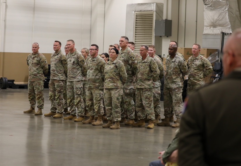 Soldiers of the 138th Operational Fires Command listen to remarks from their brigade commander, Col. Robert Andersen, during his promotion ceremony at the Lexington Armory, May 30, 2025.