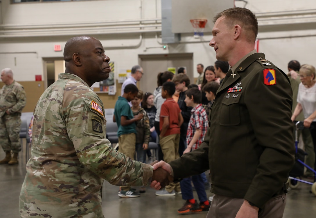 U.S. Army Lt. Col. Douglas 'Kelly' Smith congratulates Col. Robert Andersen on his promotion after a ceremony at the Lexington Armory, May 30, 2025