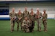 A group of airmen assigned to the 319th Security Forces Squadron and the 5th Security Forces Squadron pose for a photo at Grand Forks Air Force Base, N.D., May 13, 2025.
