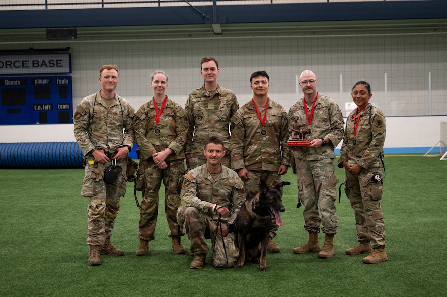 A group of airmen assigned to the 319th Security Forces Squadron and the 5th Security Forces Squadron pose for a photo at Grand Forks Air Force Base, N.D., May 13, 2025.