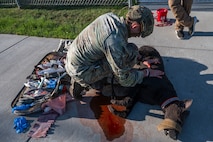Senior Airman Caleb Manges, 319th Security Forces Squadron military working dog handler, trains in tactical combat casualty care on a Diesel Advanced Canine Medical Trainer at Grand Forks Air Force Base, N.D., May 13, 2025.